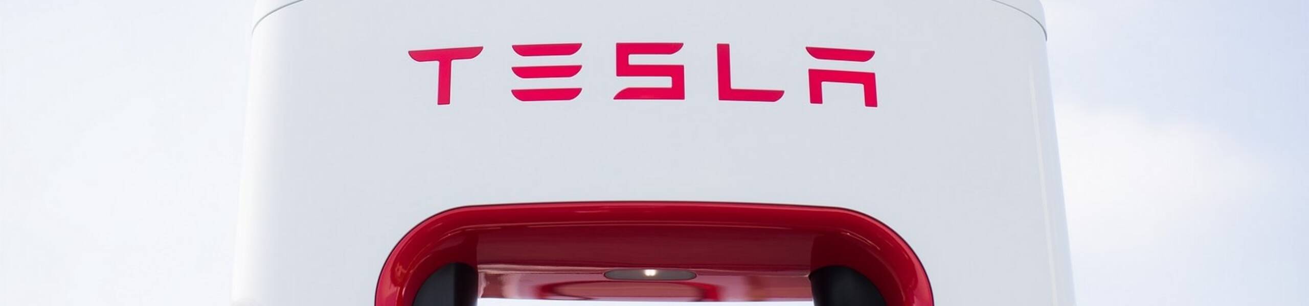 Tesla leads Nasdaq to record highs